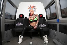 Alt German chick Kitty Core peels on the Bums Bus to show big tits & tats