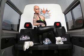 Alt German chick Kitty Core peels on the Bums Bus to show big tits & tats