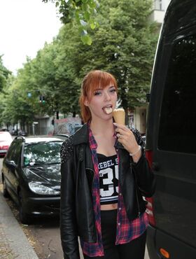 Sexy German redhead teases with ice cream and flashes her cute boobs in public