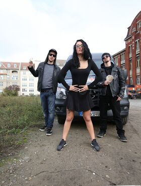 Raven-haired German girl enters in a van and takes off a skirt to toy her cunt