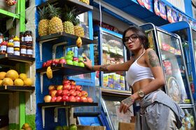 Tempting tattooed Latina eats and licks a banana provocatively in public