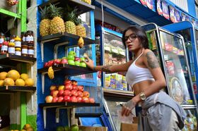 Tempting tattooed Latina eats and licks a banana provocatively in public