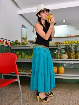 Pretty Colombian girl eats fruit & peels down to pose naked in hat & belt