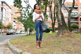 Attractive Latina Penelope Perez posing outside clothed in tight jeans & scarf