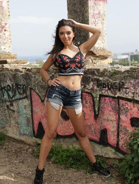 Hot Latina Frida Sante strips outdoors showing attitude & natural medium tits