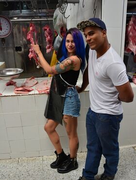 Kinky purple haired Colombian chick fucks a black dude at the meat market