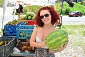 Curly redhead Latina with small tits & big clit gets nude to eat a melon