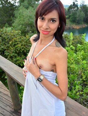 Skinny redhead Latina Ximena Soto shows off her tiny tits outdoors