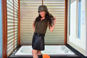 Naughty Colombian chick in soldier costume flips the bird while posing
