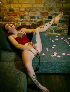 Tattooed redhead Bryla masturbates with a pump up dildo during solo action