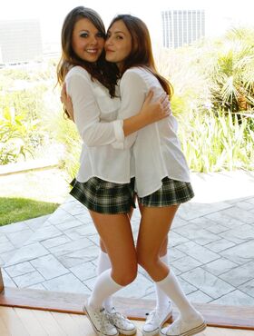 Sexy lesbian students Cali Cassidy & Cassie pose topless in school uniform