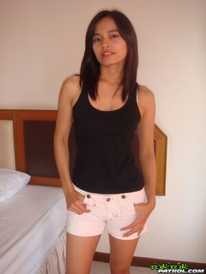 Tuk Tuk Patrol - Petite girl from Thailand does a slow striptease on top of a motel bed