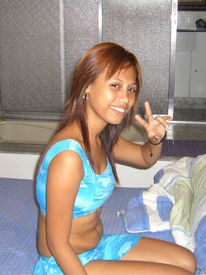 Trike Patrol - Filipina amateur takes off her clothed for her first nude shoot on a bed